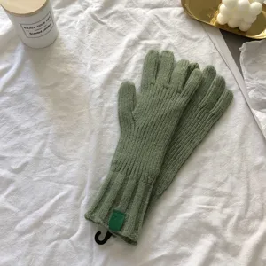 Winter warm green knitted gloves for women, solid color fleece lined thermal gloves.