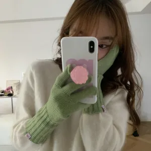 Solid color knitted wool gloves with brand label, warm and touch screen friendly.