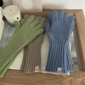 Solid color knit touchscreen gloves for winter season, fashion style warm outdoor wear detail shot.
