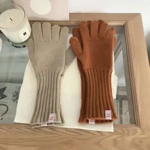 Solid color knit touchscreen gloves with long ribbed cuffs for autumn and winter warmth.