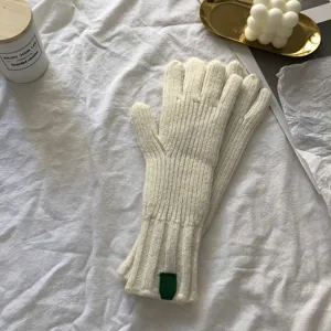 Cozy thick winter knit gloves for women, warm solid color knitted gloves detail view.