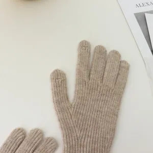 Close-up detail of beige ribbed knit touch-screen gloves, warm winter accessory feature.