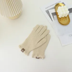 Cozy beige knit touchscreen gloves for women, cute frill detail winter warm gloves.