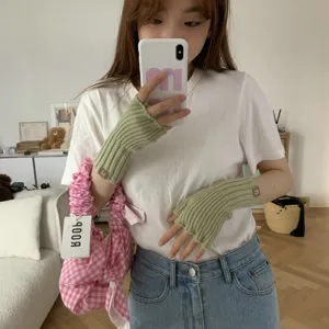 Green knit fingerless gloves for women, warm winter arm warmers and wrist guards.