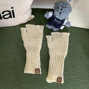 Women's winter warm half-finger knit gloves, solid color thick ribbed fingerless wrist warmers.