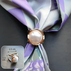 Close up detail of elegant gold metal pearl scarf ring buckle showing exact size and texture.