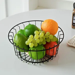 Nordic minimalist black metal wire fruit basket, hollow round modern snack storage tray for living room.