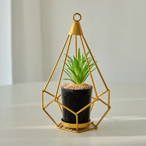 Geometric iron plant stand with faux succulent, modern minimalist gold home decor main image.