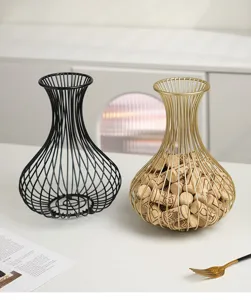 Detail view of metal wine cork storage baskets, decorative wire container set for home decor.
