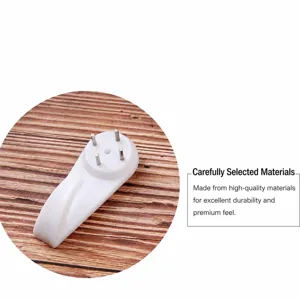 Gancio da parete invisibile in plastica bianca con perni metallici per quadri e cornici.