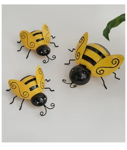 Decorative metal bee ornaments set of 3, yellow and black finish, ideal for garden and wall decor.