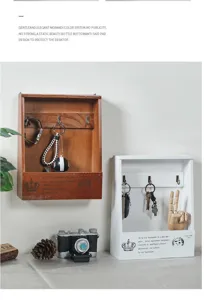 Retro wooden wall-mounted key storage box detail, vintage home entryway decor item.