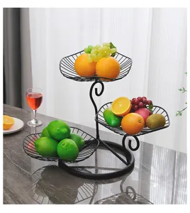 Detail view of the modern 3-tier black metal fruit basket stand for living room table.