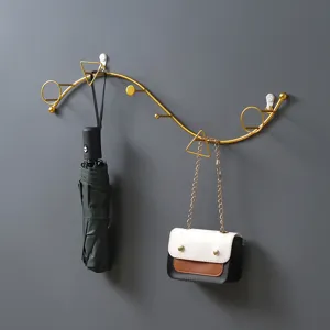 Colgador de pared moderno y creativo de hierro dorado para la entrada o pasillo.