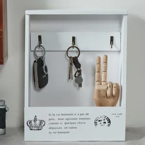 Retro wooden wall-mounted key holder box with hooks for entryway home decor organization.