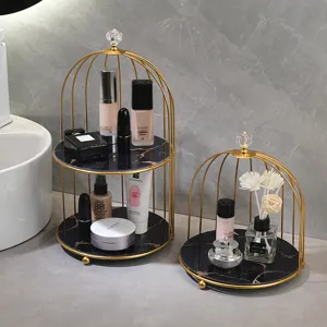 Gold metal birdcage cosmetic storage rack with black marble tray for bathroom vanity organizer