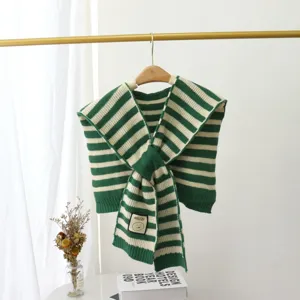 Detailed view of the stylish green and white striped knitted faux collar scarf with a cute label.