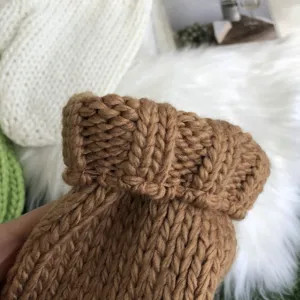 Cozy brown thick-knit winter gloves detailed close-up shot, soft texture for students.