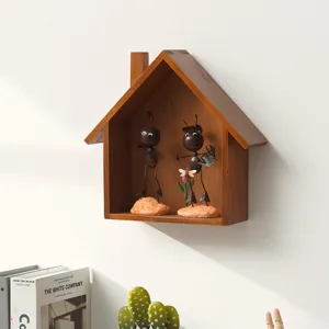 Vintage wooden house wall shelf with metal ant figurines, rustic home decor for hallway.
