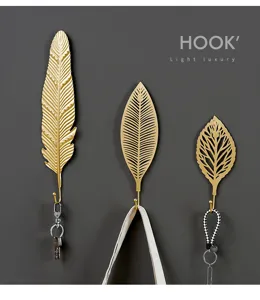 Nordic gold leaf wall hook detail, decorative iron hook for entryway or bedroom storage.