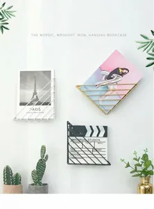 Detail view of nordic geometric iron wall mounted magazine holder and book shelf decor.