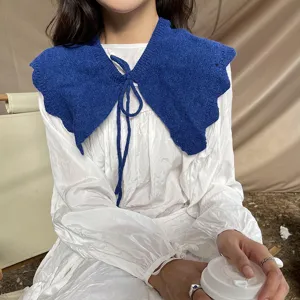Blue knitted ruffle fake collar shawl with tie bow detail, stylish spring accessory.