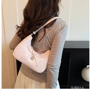 Sac à l'épaule rose avec nœud pour femmes, sac croissant chic et tendance avec charm cœur.