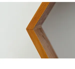 Wooden hexagonal shelf corner detail showing exquisite craftsmanship and natural wood grain.