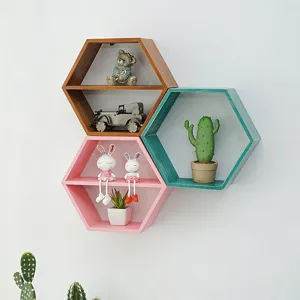 Set of 3 hexagonal wooden wall shelves, geometric hanging storage display for living room bedroom.