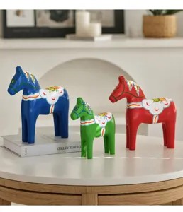 Hand-painted wooden Dala horse figurine detail showcasing vibrant colors and Nordic decor.