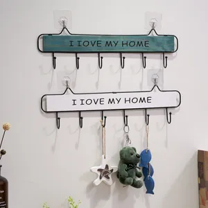 Wooden wall mounted coat hook with multiple iron hooks for home organization and decor.