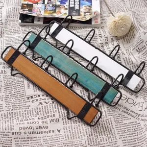 Creative wooden and iron wall mounted key and coat hook rack for home hallway decor.