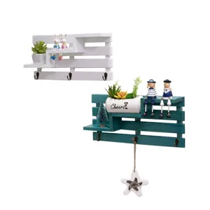 Creative wooden wall mounted storage shelf with key hooks and decorative display pots for home.