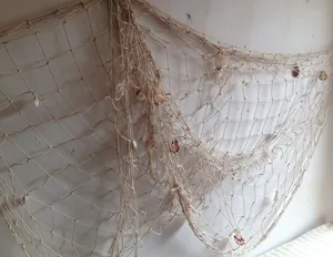 Mediterranean decorative fishing net with shells, perfect for wall decor and photography props.