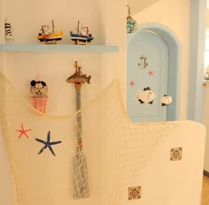 Mediterranean style decorative fishing net and wall hanging scene detail props display.