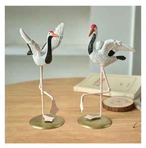 Exquisite resin red-crowned crane ornament pair for garden courtyard and indoor desktop decor.