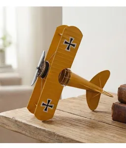 Vintage metal biplane model, retro iron airplane desktop ornament for home decor display.