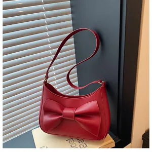 Chic red shoulder bag for women with elegant front bow stylish PU leather underarm handbag.