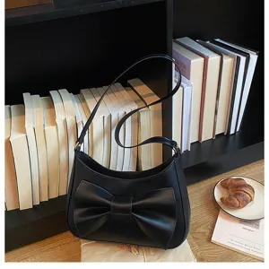 Elegant black underarm shoulder bag for women featuring a stylish front bow design.