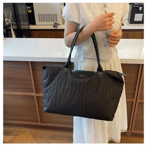 Detailed view of the lightweight nylon tote bag, perfect for travel, yoga, and daily commute.