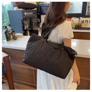 Stylish black nylon tote bag for women, large capacity lightweight shoulder travel bag.