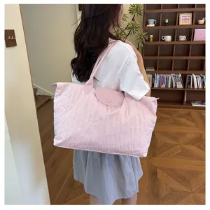 Pink quilted shoulder bag for women, large capacity travel tote bag with leather flap.