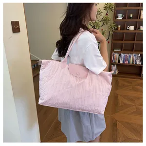 Casual pink quilted shoulder bag, large capacity travel tote for women daily commute use.
