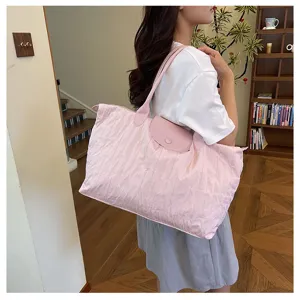 Pink quilted shoulder tote bag for women, large capacity commuter travel casual handbag.