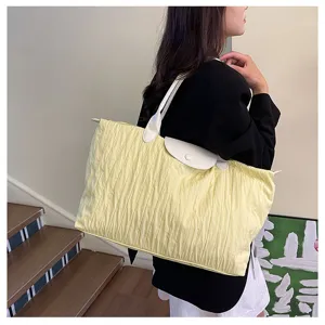 Stylish pleated shoulder bag for women, large capacity casual travel tote for daily use.
