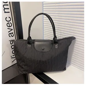 Black nylon tote bag with leather flap casual large capacity travel shoulder bag.