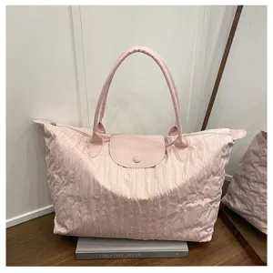 Pink large capacity nylon folding shoulder bag casual travel tote with leather handle.
