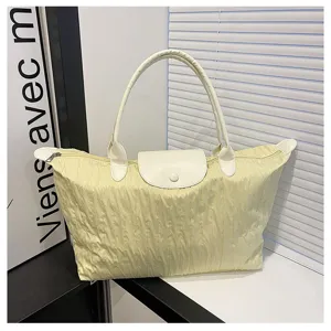 Casual nylon folding tote bag for women, lightweight travel shoulder bag with top handle.