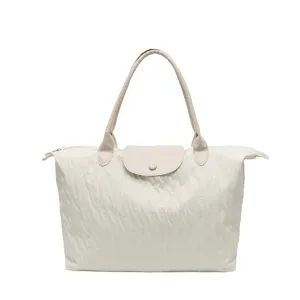 Large capacity beige nylon shoulder bag casual travel tote with leather flap handle.