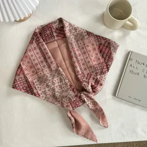 Retro botanical print triangular scarf detail, vintage cotton bandana in elegant pink hues.